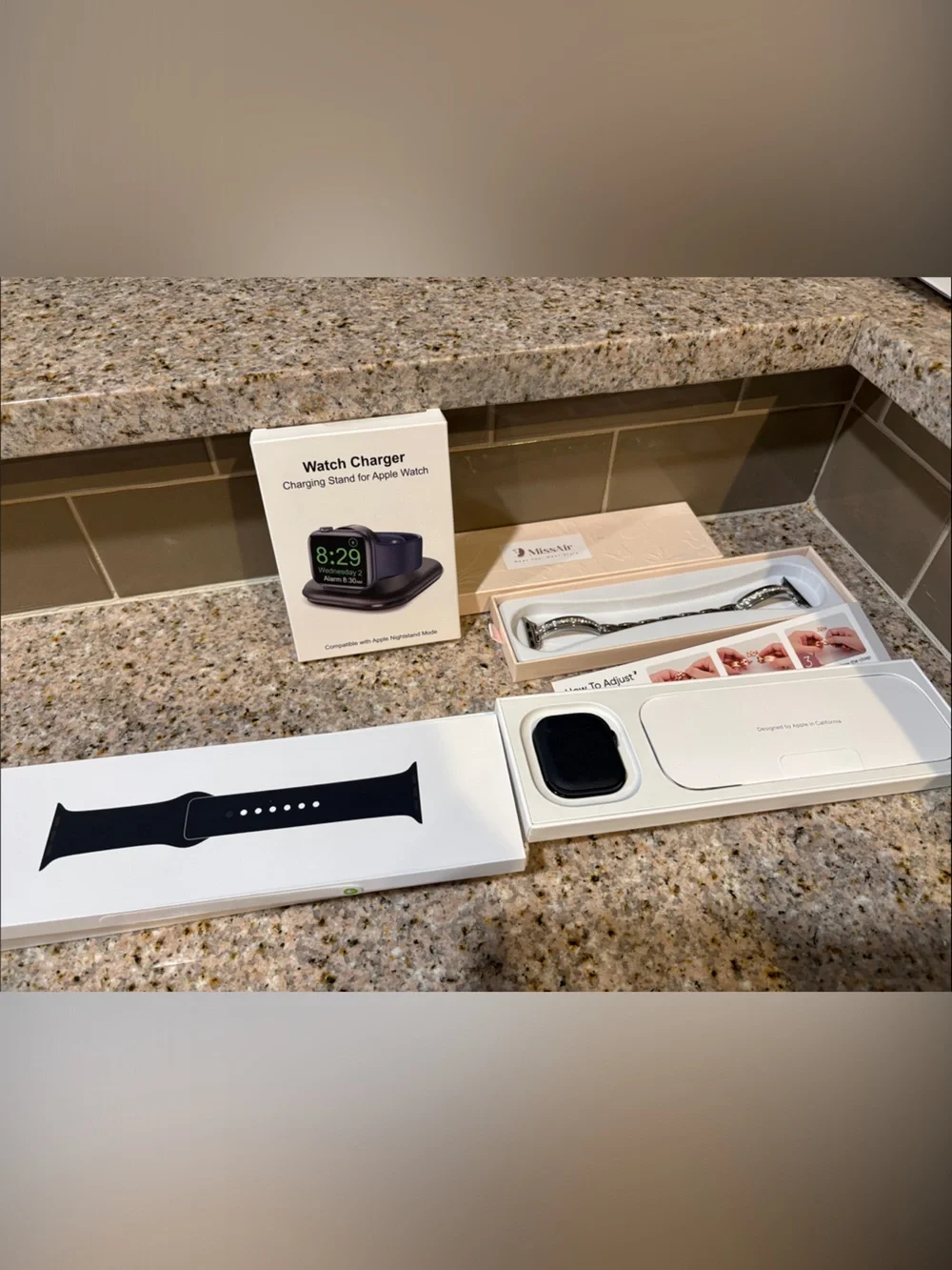 Apple Black Silicone Watch Band with Silver Bracelet Accent and Charging Dock